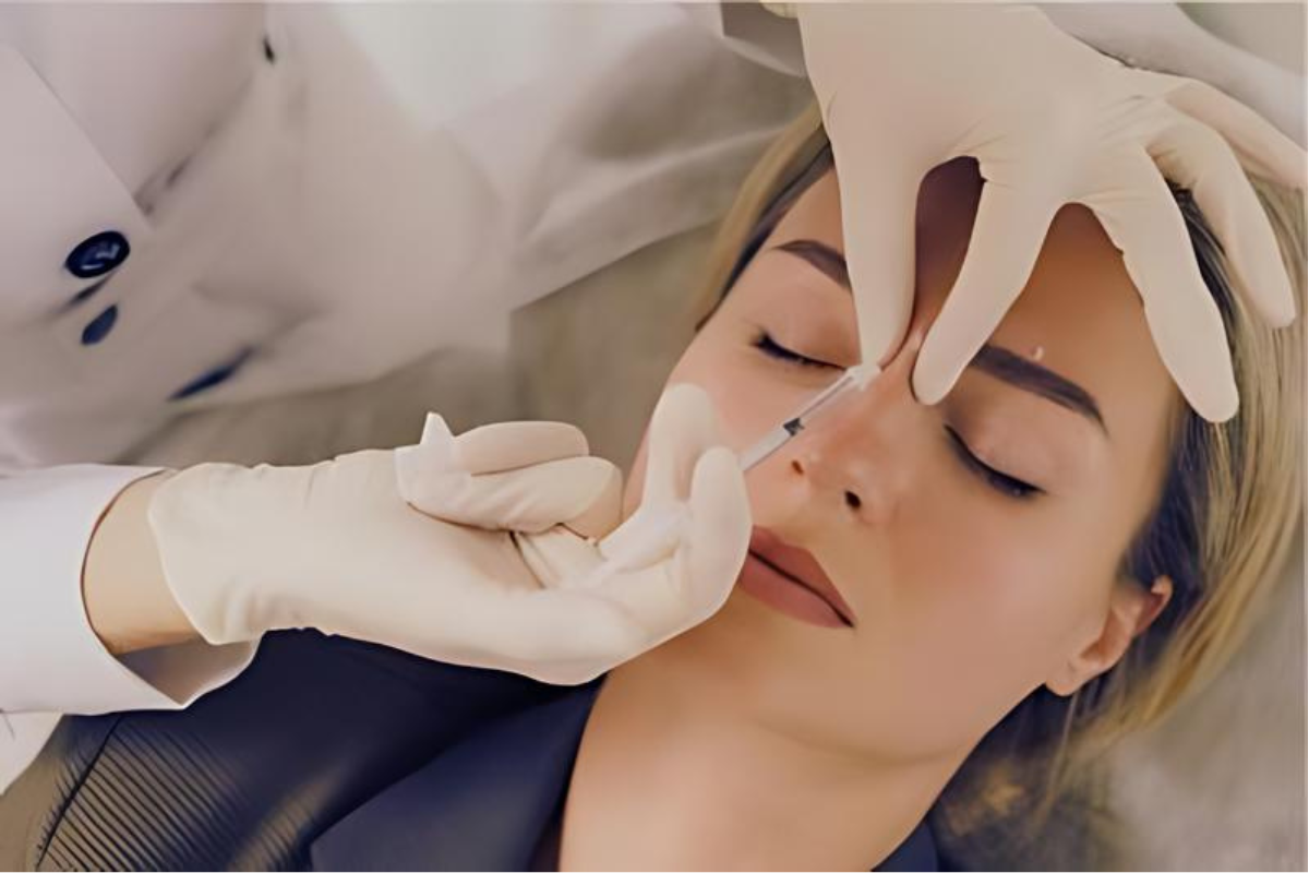 Aesthetic practitioner administering Botox anti-wrinkle injections to a client's forehead. The image captures the precise injection process aimed at reducing fine lines and wrinkles, promoting a smoother, more youthful appearance. Shrewsbury Shropshire